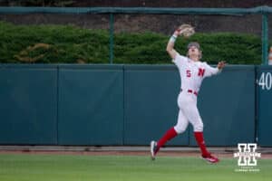Kansas St. Wildcat infielder Shintaro Inoue (5) scores in the seventh inning against Nebraska Cornhusker catcher Hogan Helligso (10) during a college baseball game Tuesday, April 29, 2025 in Lincoln, Nebraska. Photo by John S. Peterson.