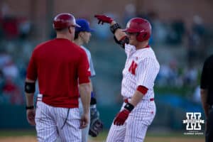 Nebraska Cornhusker utility Max Buettenback (11) gets a single in the sixth inning against the Kansas St. Wildcats during a college baseball game Tuesday, April 29, 2025 in Lincoln, Nebraska. Photo by John S. Peterson.