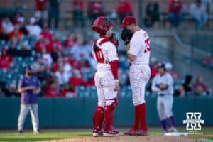 Nebraska Cornhusker pitcher Drew Christo (25) and catcher Hogan Helligso (10) have a meeting against the Kansas St. Wildcats in the sixth inning during a college baseball game Tuesday, April 29, 2025 in Lincoln, Nebraska. Photo by John S. Peterson.