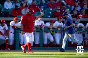 Nebraska Cornhuskers pitching coach Rob Childress signals for another pitch against the Kansas St. Wildcats in the sixth inning during a college baseball game Tuesday, April 29, 2025 in Lincoln, Nebraska. Photo by John S. Peterson.