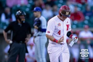Nebraska Cornhusker infielder Josh Overbeek (4) jogs to first base after being hit by a pitch in his right hand against the Kansas St. Wildcats in the fifth inning during a college baseball game Tuesday, April 29, 2025 in Lincoln, Nebraska. Photo by John S. Peterson.