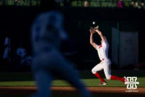 Nebraska Cornhusker infielder Dylan Carey (15) makes a catch for an out against the Kansas St. Wildcats during a college baseball game Tuesday, April 29, 2025 in Lincoln, Nebraska. Photo by John S. Peterson.