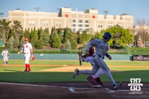 Kansas St. Wildcat infielder Sam Flores (4) scores a run against the Nebraska Cornhuskers during a college baseball game Tuesday, April 29, 2025 in Lincoln, Nebraska. Photo by John S. Peterson.