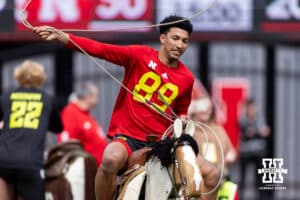 Quinn Clark trying to rope a remote controled steer during Husker games Saturday, April 26, 2025 in Lincoln, Nebraska. Photo by John S. Peterson.