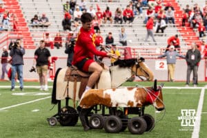 Heinrich Haarberg trying to rope a remote controled steer during Husker games Saturday, April 26, 2025 in Lincoln, Nebraska. Photo by John S. Peterson.