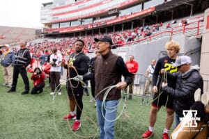 John Cook giving some advice on roping during Husker games Saturday, April 26, 2025 in Lincoln, Nebraska. Photo by John S. Peterson.