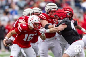 Nebraska quarterback Marcos Davilla (16) runs with the ball against linebacker Gage Stanger (47) during Husker games Saturday, April 26, 2025 in Lincoln, Nebraska. Photo by John S. Peterson.