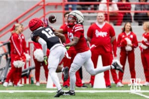 Nebraska wide receiver Jaidyn Doss (12) reaches out to make a catch against defensive back Kahmir Prescott (12) during Husker games Saturday, April 26, 2025 in Lincoln, Nebraska. Photo by John S. Peterson.
