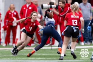 Nebraska player reaches for the flags against Midland during Husker games Saturday, April 26, 2025 in Lincoln, Nebraska. Photo by John S. Peterson.
