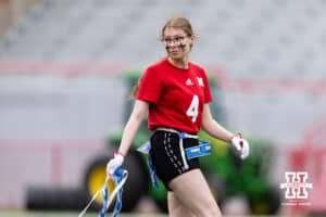 Nebraska player hold a flag belt after making a tackle against Midland during Husker games Saturday, April 26, 2025 in Lincoln, Nebraska. Photo by John S. Peterson.