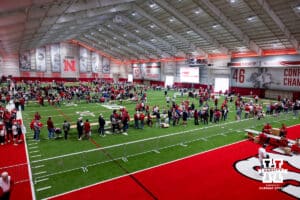 Husker fans weave through the tables for the garage sale during Husker games Saturday, April 26, 2025 in Lincoln, Nebraska. Photo by John S. Peterson.