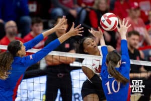 Nebraska Cornhusker Ryna Hunter (18) spikes the ball against the Kansas Jayhawks during a college volleyball match Saturday, April 26, 2025 in Lincoln, Nebraska. Photo by John S. Peterson.