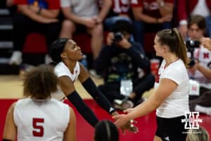 Nebraska Cornhusker Ryan Hunter (18) gives Campbell Flynn ten after a kill against the Kansas Jayhawk during a college volleyball match Saturday, April 26, 2025 in Lincoln, Nebraska. Photo by John S. Peterson.