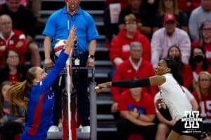 Nebraska Cornhusker Ryan Hunter (18) spikes the ball past Kansas Jayhawk Grace Nelson (1) during a college volleyball match Saturday, April 26, 2025 in Lincoln, Nebraska. Photo by John S. Peterson.