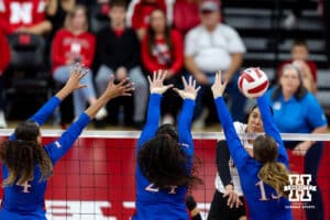 Nebraska Cornhusker Teraya Sigler (11) spikes the ball past the Kansas Jayhawks during a college volleyball match Saturday, April 26, 2025 in Lincoln, Nebraska. Photo by John S. Peterson.