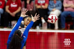 Nebraska Cornhusker Harper Murray (27) spikes the ball against Kansas Jayhawks during a college volleyball match Saturday, April 26, 2025 in Lincoln, Nebraska. Photo by John S. Peterson.