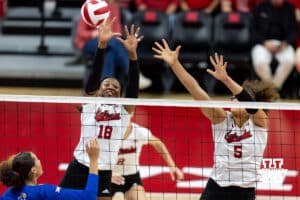 Nebraska Cornhusker Ryna Hunter (18) jumps up to block a shot against the Kansas Jayhawks during a college volleyball match Saturday, April 26, 2025 in Lincoln, Nebraska. Photo by John S. Peterson.