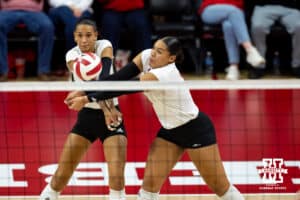 Nebraska Cornhusker Harper Murray (27) and Teraya Sigler (11) go for a dig on the ball against the Kansas Jayhawk during a college volleyball match Saturday, April 26, 2025 in Lincoln, Nebraska. Photo by John S. Peterson.