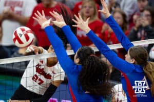 Nebraska Cornhusker Harper Murray (27) spikes the ball past the Kansas Jayhawks during a college volleyball match Saturday, April 26, 2025 in Lincoln, Nebraska. Photo by John S. Peterson.