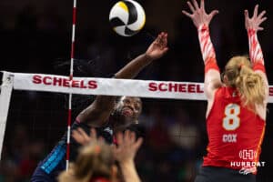 Omaha Supernovas Toyosi Onabanjo (21) spikes the ball against Columbus Fury Kaylee Cox (8) during a college volleyball match Friday, April 25, 2025 in Omaha, Nebraska. Photo by John S. Peterson.