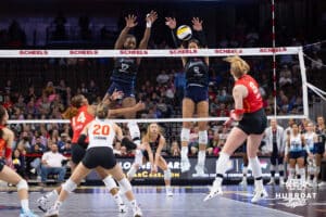 Omaha Supernovas Phoebe Awoleye (17) and Omaha Supernovas Reagan Cooper (8) block a spike from Columbus Fury Kaylee Cox (8) during a college volleyball match Friday, April 25, 2025 in Omaha, Nebraska. Photo by John S. Peterson.