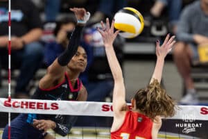 Omaha Supernovas Kelsie Payne (11) spikes the ball against Columbus Fury Megan Courtney-Lush (17) during a college volleyball match Friday, April 25, 2025 in Omaha, Nebraska. Photo by John S. Peterson.