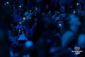Omaha Supernovas fans holding their phones up to be used in a light show for the match against the Columbus Fury during a professional volleyball match Friday, April 25, 2025 in Omaha, Nebraska. Photo by John S. Peterson.