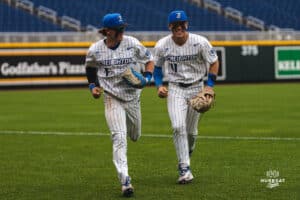 Creighton Bluejay Nolan Sailors celebrates his catch with teammate Ben North during a baseball game at Charles Schwab Field on Thursday, April 17th, 2025 in Omaha Nebraska. Photo by Collin Stilen.