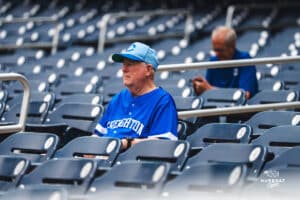 Creighton Bluejay fan in the stands enjoying the nice weather during a baseball game at Charles Schwab Field on Thursday, April 17th, 2025 in Omaha Nebraska. Photo by Collin Stilen.