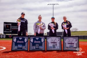 Seniors (Left to rigfht) Sydney Thompson (19), Anna Chapman (16), Rylan Ewoldt (11) and Maggie O'Brien (1) pose for a picture after senior day recognition Saturday, April 19, 2025 in Omaha, Nebraska. Photo by Braden Cochran.
