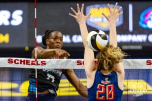 Omaha Supernova Phoebe Awoleye (17) spikes the ball against Grand Rapid Rise Eleanor Holthaus during the professional volleyball match Thursday, April 17, 2025 in Omaha, Nebraska. Photo by John S. Peterson.