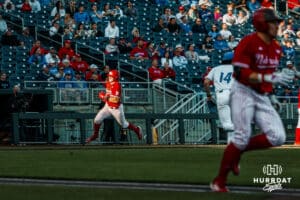 Nebraska Cornhusker Dylan Carey (15) runs home from an Overbeek base hit against the Creighton Bluejays during a college baseball game on Tuesday, April 15, 2025 in Lincoln, Nebraska. Photo by Jansen Coburn.
