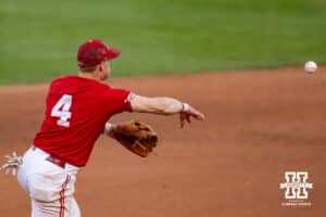 Nebraska Cornhusker infielder Josh Overbeek (4) throws to second against the Kansas Jayhawks during a college baseball game Tuesday, April 22, 2025 in Lincoln, Nebraska. Photo by John S. Peterson.