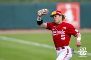 Nebraska Cornhusker outfielder Robby Bolin (5) runs in with the ball he caught in the outfield against the Kansas Jayhawks during a college baseball game Tuesday, April 22, 2025 in Lincoln, Nebraska. Photo by John S. Peterson.
