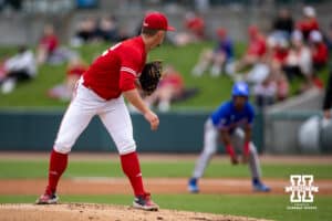 Nebraska Cornhusker pitcher Tucker Timmerman (32) looks to first base against Kansas Jayhawk infielder Dariel Osoria (23) during a college baseball game Tuesday, April 22, 2025 in Lincoln, Nebraska. Photo by John S. Peterson.
