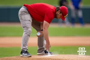 Grounds crew getting the mound ready for the game between the Nebraska Cornhuskers and the Kansas Jayhawks during a college baseball game Tuesday, April 22, 2025 in Lincoln, Nebraska. Photo by John S. Peterson.