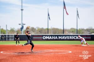 Omaha Maverick Maddia Groff (6) throws a pitch against South Dakota with a runner on second base Saturday, April 19, 2025 in Omaha, Nebraska. Photo by Braden Cochran.