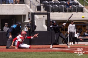 Omaha Maverick Marra Cramer (9) gets a base hit in the fourth inning against South Dakota Saturday, April 19, 2025 in Omaha, Nebraska. Photo by Braden Cochran.