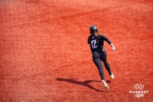 Omaha Maverick Katherine Johnson (12) hits a double running to second base against South Dakota Saturday, April 19, 2025 in Omaha, Nebraska. Photo by Braden Cochran.