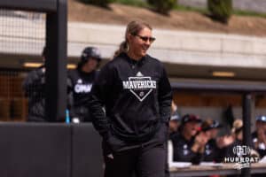 Omaha assistant coach Jen Daro walks over the first base against South Dakota Saturday, April 19, 2025 in Omaha, Nebraska. Photo by Braden Cochran.