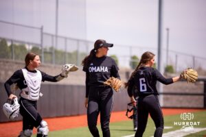 Rylinn Groff (21) Sydney Thompson (19) and Maddia Groff (6) welcome their teammates back to the dugout after a quick inning against South Dakota Saturday, April 19, 2025 in Omaha, Nebraska. Photo by Braden Cochran.