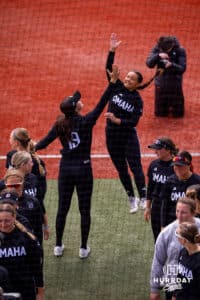 Sydney Thopmson (19) makes Gabby Salazar (4) jump for a high five during introductions Saturday, April 19, 2025 in Omaha, Nebraska. Photo by Braden Cochran.