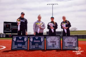 Seniors (Left to rigfht) Sydney Thompson (19), Anna Chapman (16), Rylan Ewoldt (11) and Maggie O'Brien (1) pose for a picture after senior day recognition Saturday, April 19, 2025 in Omaha, Nebraska. Photo by Braden Cochran.