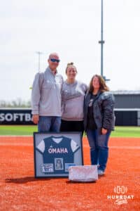 Anna Chapman (16) poses with her parents on senior day Saturday, April 19, 2025 in Omaha, Nebraska. Photo by Braden Cochran.