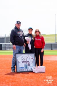Rylan Ewoldt (11) poses with her parents on senior day Saturday, April 19, 2025 in Omaha, Nebraska. Photo by Braden Cochran.