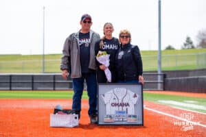 Maggie O'Brien (1) poses with her parents on senior day Saturday, April 19, 2025 in Omaha, Nebraska. Photo by Braden Cochran.