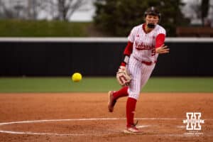 Nebraska Cornhusker Hannah Camenzind (9) throws a pitch against the Indiana Hoosiers during a college softball game Friday, April 18, 2025 in Omaha, Nebraska. Photo by John S. Peterson.