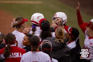Nebraska Cornhusker Jordyn Bahl (98) gives Emmerson Cope a hug after hitting a home run against the Indiana Hoosiers during a college softball game Friday, April 18, 2025 in Omaha, Nebraska. Photo by John S. Peterson.
