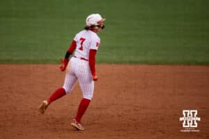 Nebraska Cornhusker Ava Kuszak (7) celebrates Emmerson Cope's home run against the Indiana Hoosiers during a college softball game Friday, April 18, 2025 in Omaha, Nebraska. Photo by John S. Peterson.