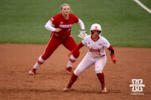 Nebraska Cornhusker Ava Kuszak (7) leading off against Indiana Hoosier utility Alex Cooper (31) during a college softball game Friday, April 18, 2025 in Omaha, Nebraska. Photo by John S. Peterson.
